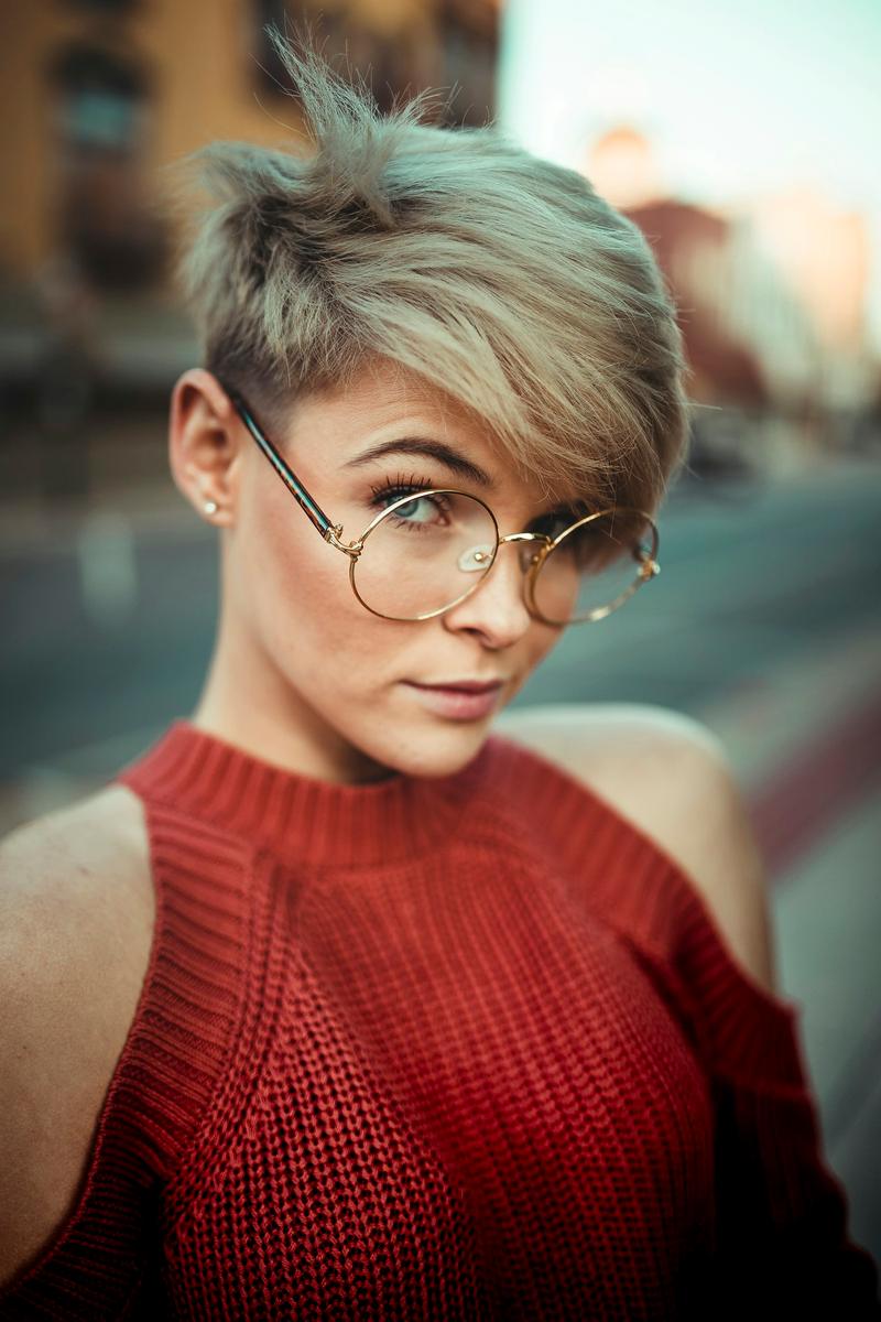 A textured ash-blonde pixie with a long sweep at the front